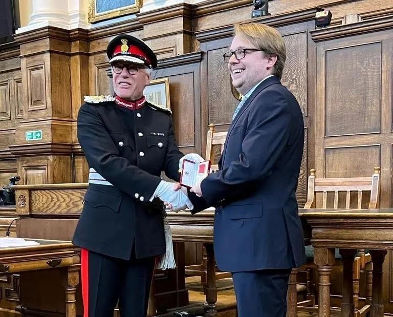 PPE hero is presented with his British Empire Medal